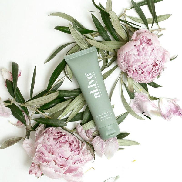 Discover the al.ive body Peony & Olive Leaf Natural Hand Balm, a deeply moisturizing formula that leaves hands nourished without greasiness. Crafted from 100% recyclable PE plastic, enriched with shea butter and coconut oil. Features a floral scent with citrus and herbal undertones. Now avaiable at Folk Road West Kempsey Nsw 2440