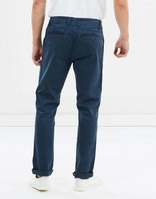 The Baxter Chino Pant is an essential in every guys wardrobe. In woven cotton/elastane twill this slim fit chino pant has a fixed waist, angled front pockets with herringbone tape detail and coin pocket, and back welt pockets with button closure and stitch detail. Available at My Harley and Rose.