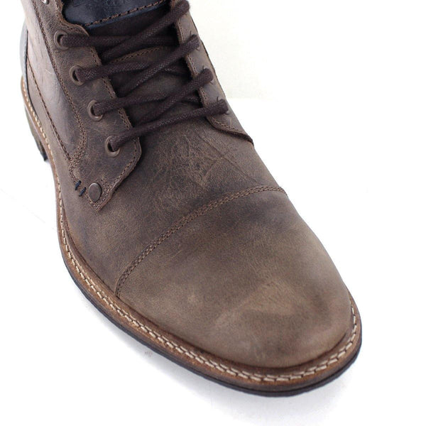 Clifton Hand-crafted from full grain European leather, Clifton is a wardrobe essential for cool casual styling. With a contrast heel cap and stitching details, this boot has plenty of charm. Read Less – Contrast heel cap – Stitched toe cap – Embossed with our signature Wild Rhino – Hand-stitched seams -Inside zip closure for easy fitting. Upper: Premium First Grade Full Grain Leather Lining: Premium Textile Sole: Rubber Country of Manufacture: Portugal. Available at My Harley and Rose.