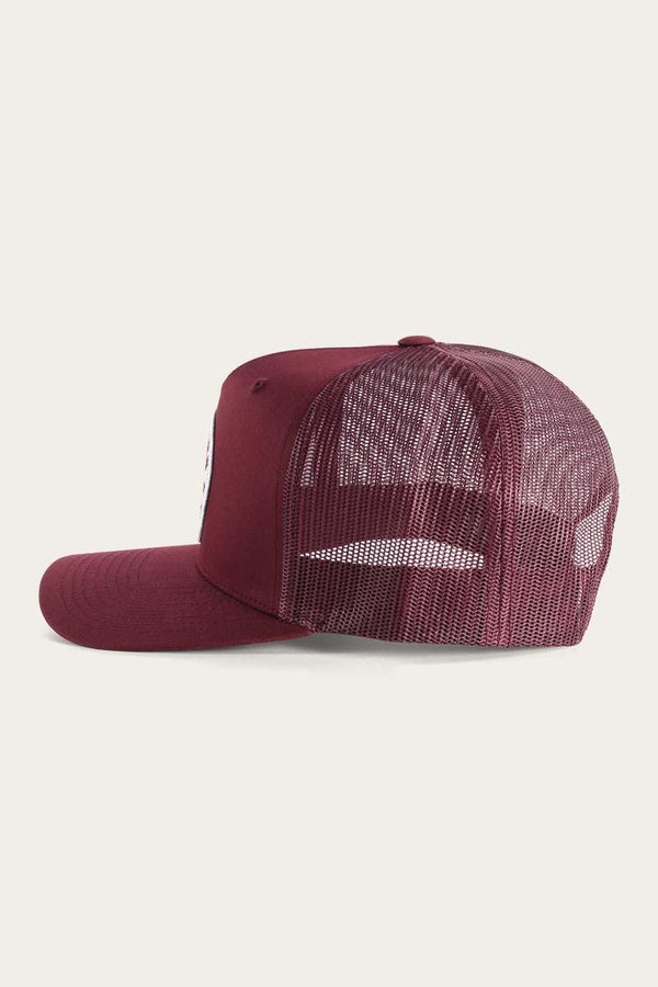 Signature Bull trucker cap in rich burgundy, features a snapback with a white patch, a breathable mesh back, and a durable cotton twill peak. $39.95
